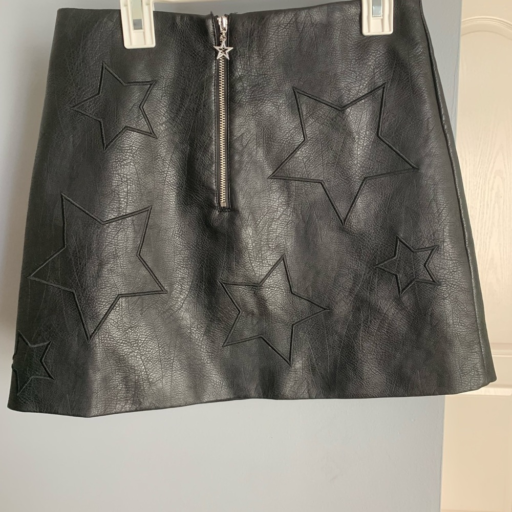 Faux leather, black, mini skirt. Fully unzips, no shorts. (Runs small)